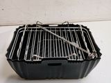 a small black box with a grill inside of it