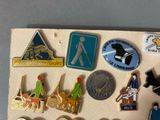 a lot of pins on a piece of paper on a table