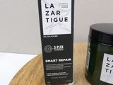 a picture of a jar of lazarr tique next to a box on a table