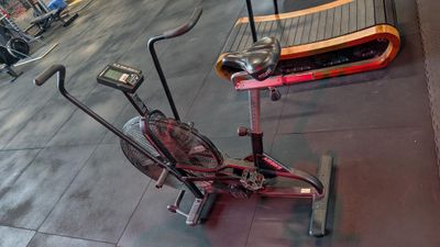 a stationary exercise bike on the floor in a gym
