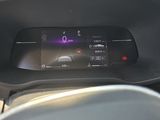 the dashboard of a car with a digital display in the center