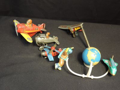 a lot of toys that are sitting on a black surface