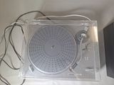 a turntable that is sitting in a clear box