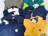 a lot of clothes that are sitting on a table