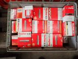 many boxes of cigarettes sitting in a bin on a pallet