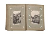 an old photo of a book opened to show a picture of a castle