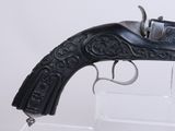 a gun that is on display in a glass case