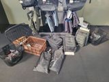 many bags of luggage sitting on the floor next to each other