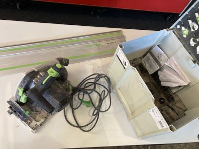 a box with a corded sander and a box with a corded sander in it