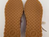 the soles of a pair of shoes on a white surface
