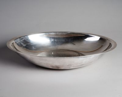 an image of a silver bowl on a white surface