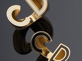 paire de bracelets manchette en or et émail noir, ornés d'initiales