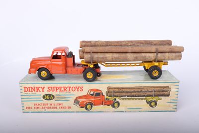 a toy truck with a large load of logs on it