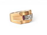 a close up of a gold ring with diamonds on a white background