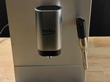 a coffee machine that is sitting on a wooden table