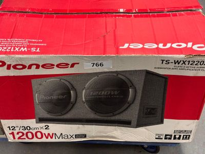 a box with two speakers in it sitting on the floor