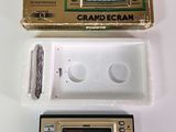 a small game console with a game in it