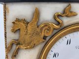 a close up of a clock with a horse on it