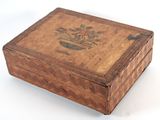 a small wooden box with a design on it