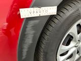 a close up of a car ' s tire with a measuring tape on it