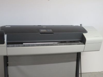 an image of a printer on a stand in a room