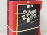 a red and black book with pictures on it