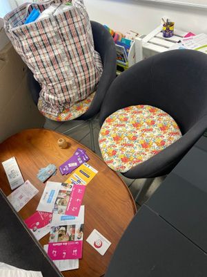 two chairs and a table in the corner of a room