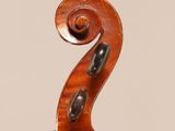 an old violin with a wooden back and a long neck