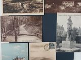 many old postcards that are on display on the wall