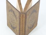 an open book with a decorative design on it