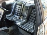 two seats in the back of a car that are black