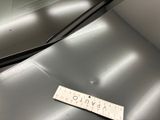 a sticker on the hood of a silver car