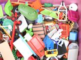 a pink bin filled with assorted toys and toys