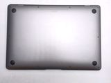 the back of a silver laptop computer sitting on top of a white surface