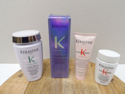 trois types différents de produits Kérastase posés sur une table