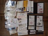 many different types of stamps and envelopes laid out on the floor