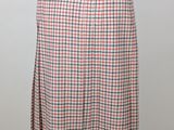 a woman ' s skirt with a red, white and blue checkered pattern