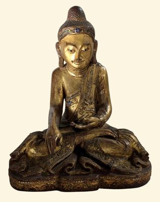 statue d'un Bouddha assis sur un rocher, tenant une fleur dans la main
