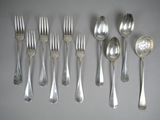 a lot of silver spoons and forks on the table