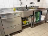 a kitchen with a sink, dishwasher, and a dishwasher