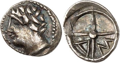 a silver coin with an image of a man on it
