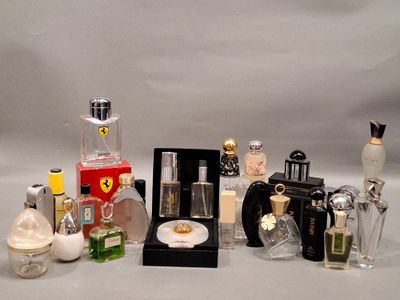 a lot of different perfumes and perfume bottles on a table