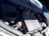 a car engine with the hood open and the hood down