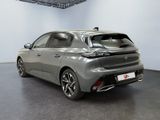 the rear view of a grey car in a showroom