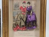 framed picture of a couple of women sitting next to a bottle of wine