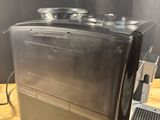 an image of a coffee machine on a wooden table