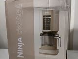 packaging of a coffee maker sitting on top of a white table