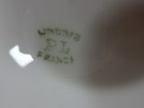 a close up view of a white plate with writing on it