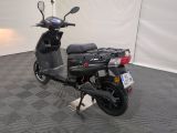 a scooter that is parked in a room
