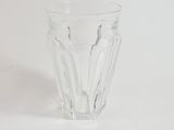 a clear glass cup with a pattern on it